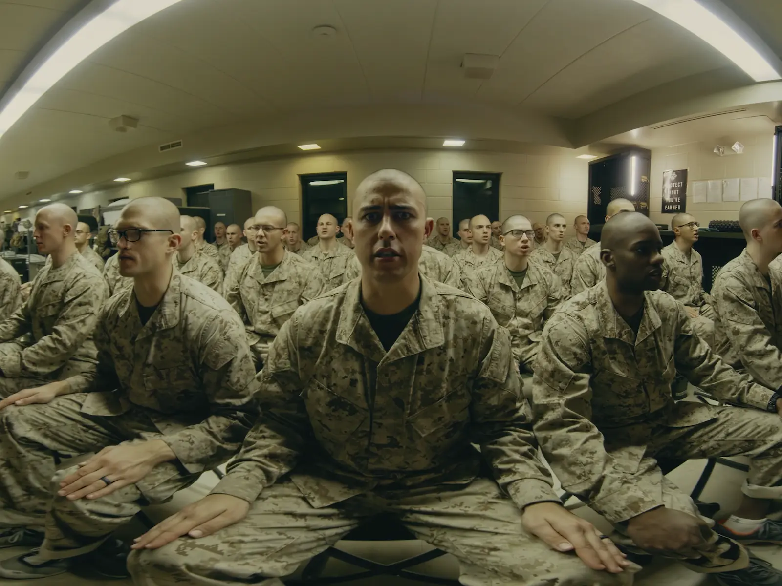 marine-stares-intently-with-fellow-marines