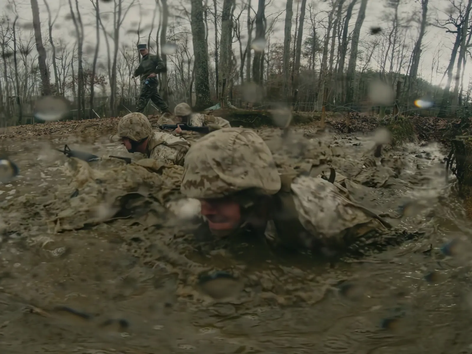 marines-crawl-through-mud-and-spray-camera