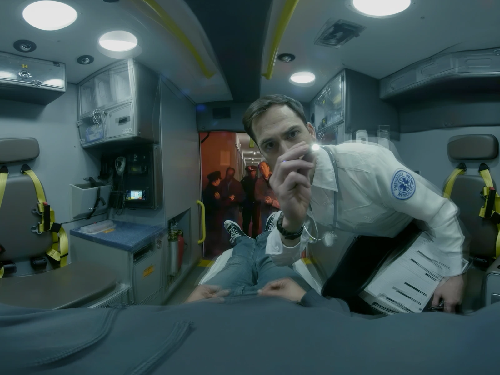 pov-in-ambulance-with-paramedic-checking-eyes